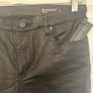 Black faux snakeskin skinny jeans